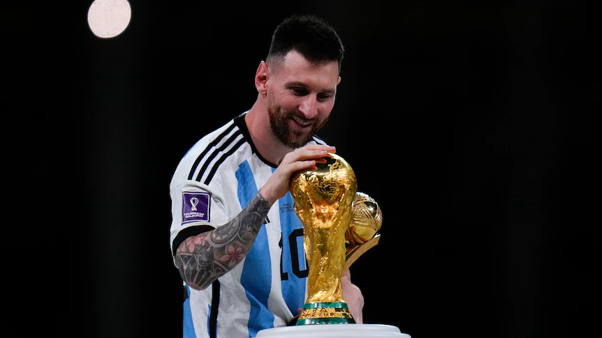 Messi holding world cup pictures. Image Credits:- ABC.